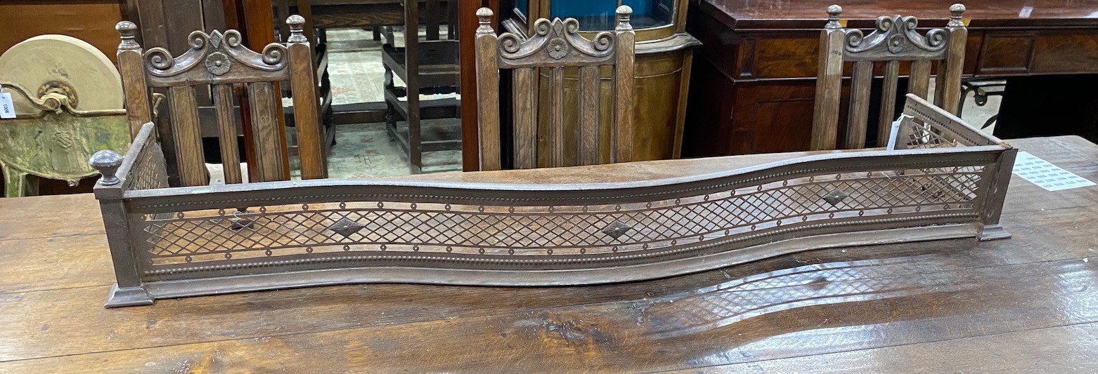 A George III serpentine steel fire curb, width 158cm